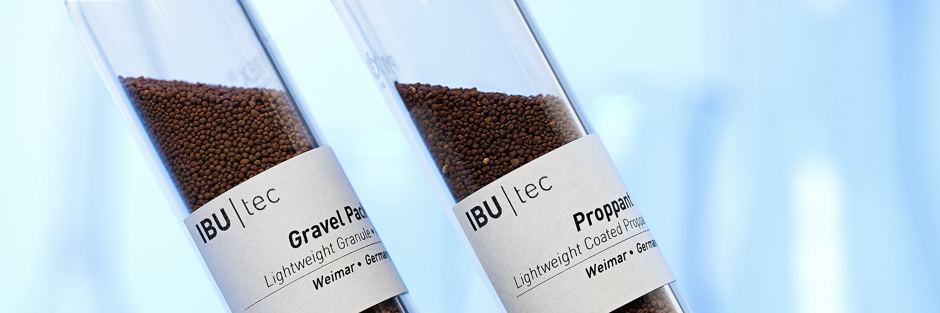 proppants and gravel pack in test tubes for mining or extraction of oil or gas from IBU-tec development