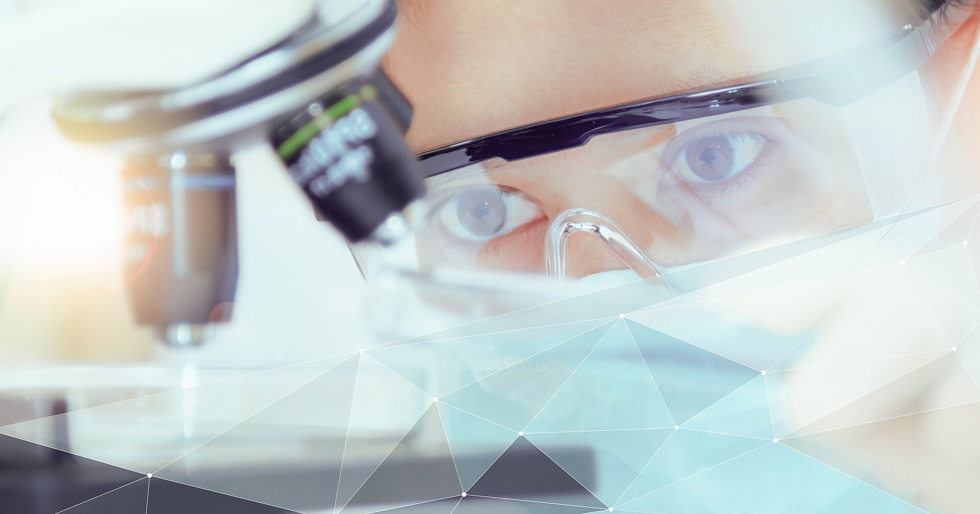 Scientists with microscope for IBU-tec material development
