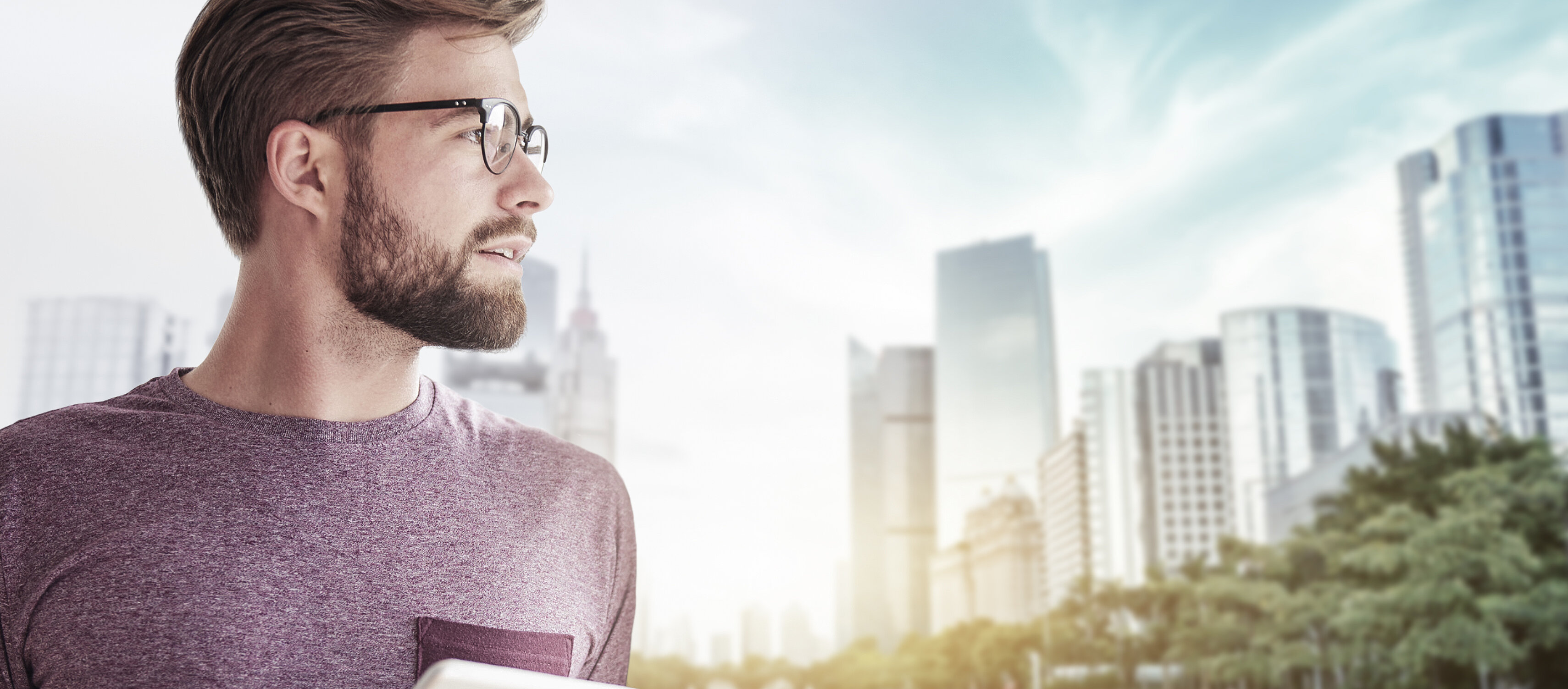 IBU-tec offers expertise in thermal process technology as well as capacity for tolling with chemical materials, portraied in a picture of a bearded man with glasses and tablet computer in front of a connected smart city