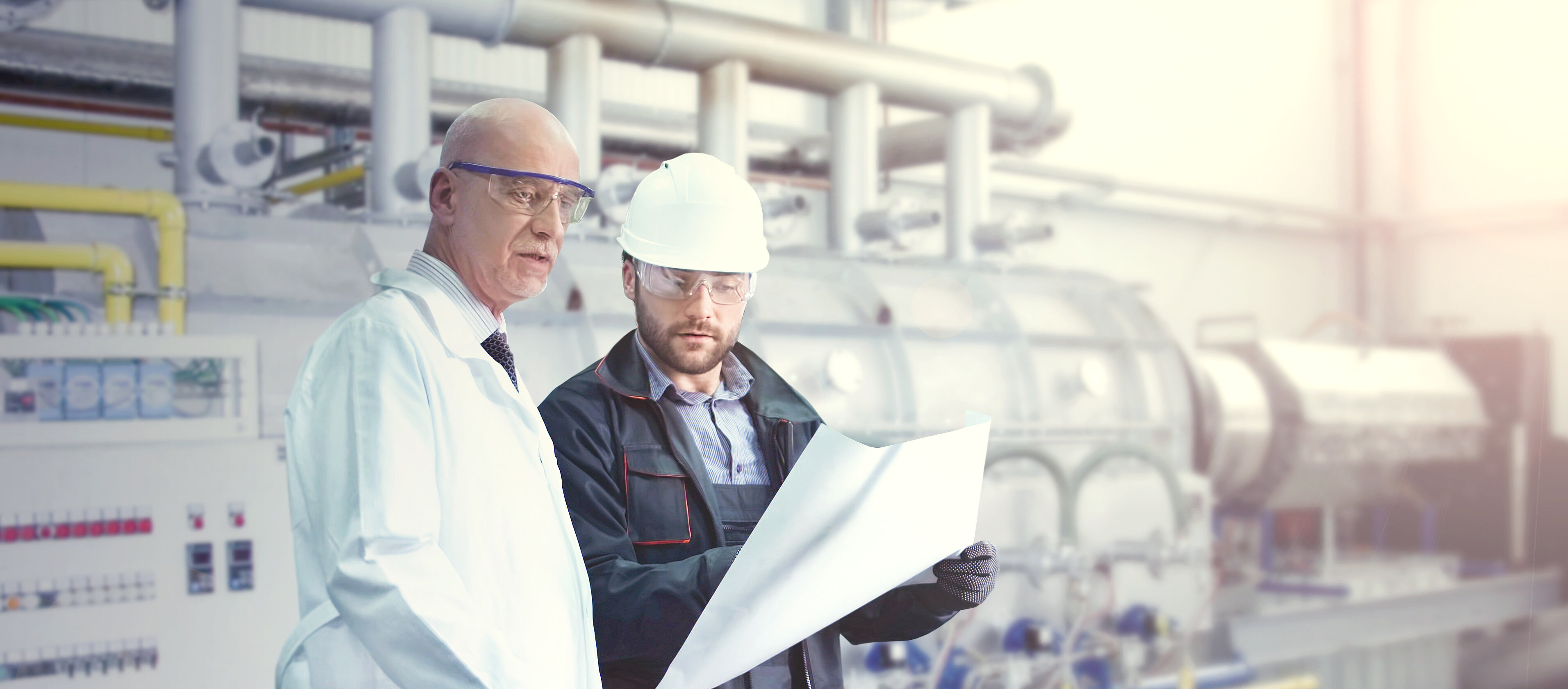 Engineers at IBU-tec in front of an indirect fired rotary kiln