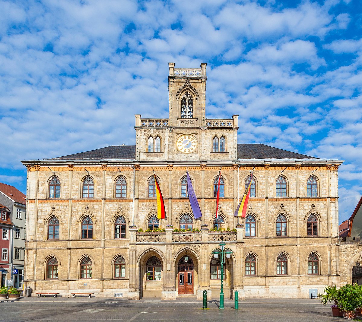 Weimar town hall with market place and flags, classical Weimar with beautiful architecture